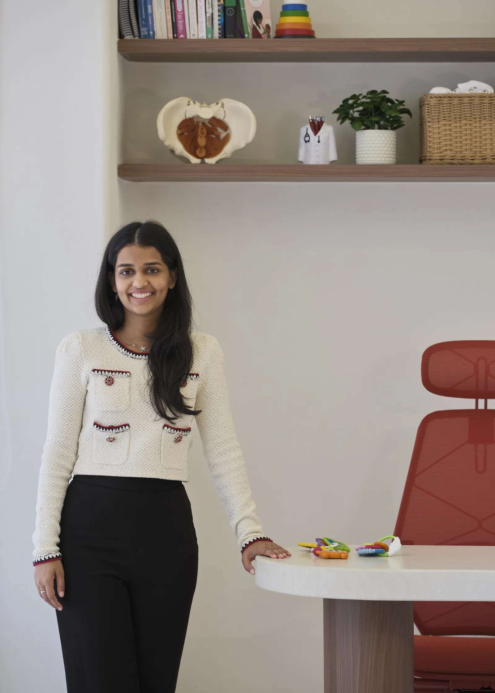 Dr. Ami at her consultation desk in the osteopathy room